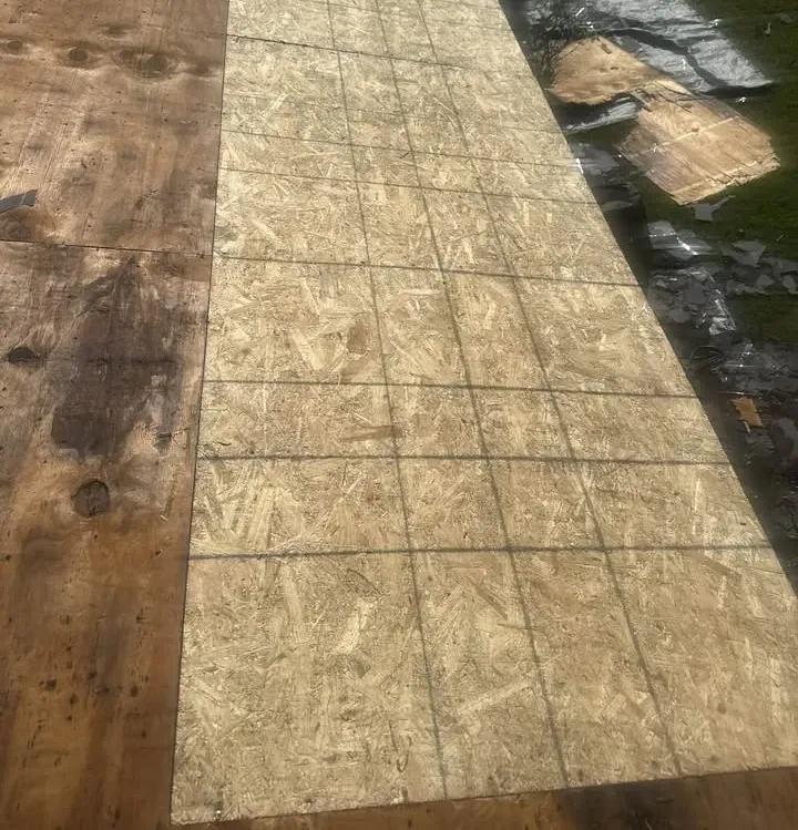 Fresh roof decking installed after rotted boards were removed