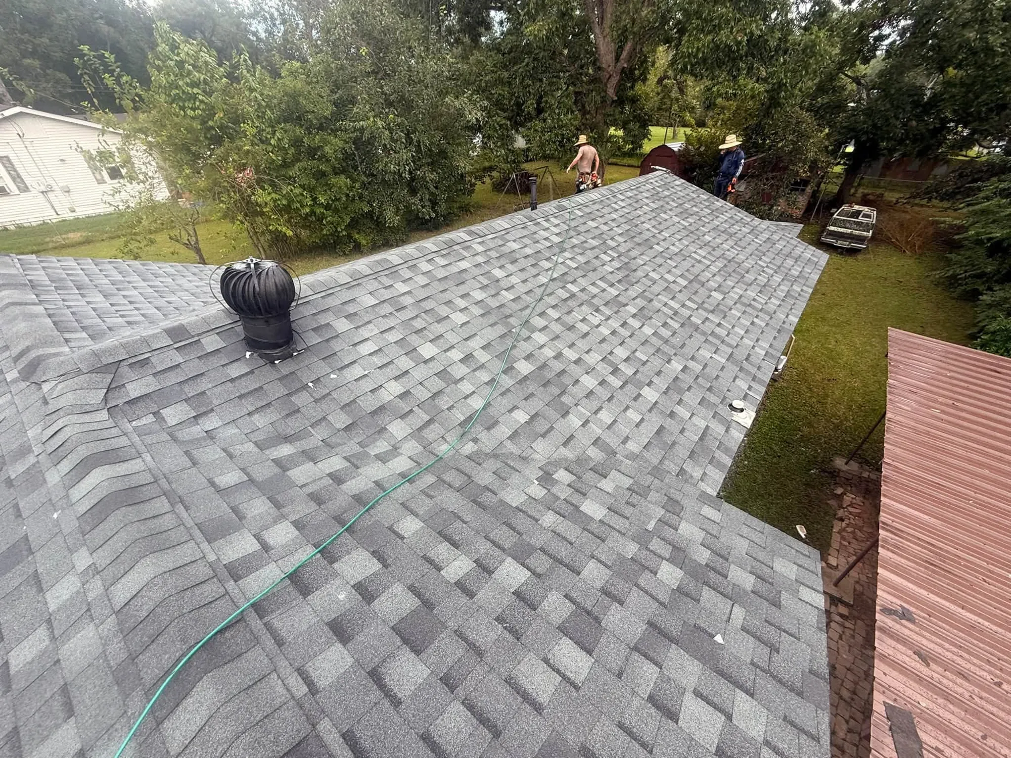 New shingle roof with a turbine vent near the ridge