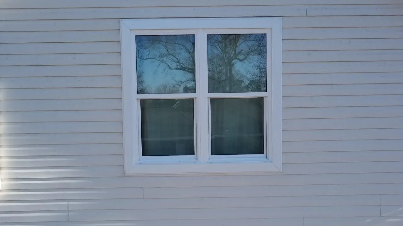 Double window set in new vinyl siding